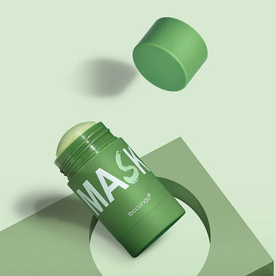 Close-up of green tea cleansing stick mask container with water droplets, portable skin care product for deep cleansing and skin care