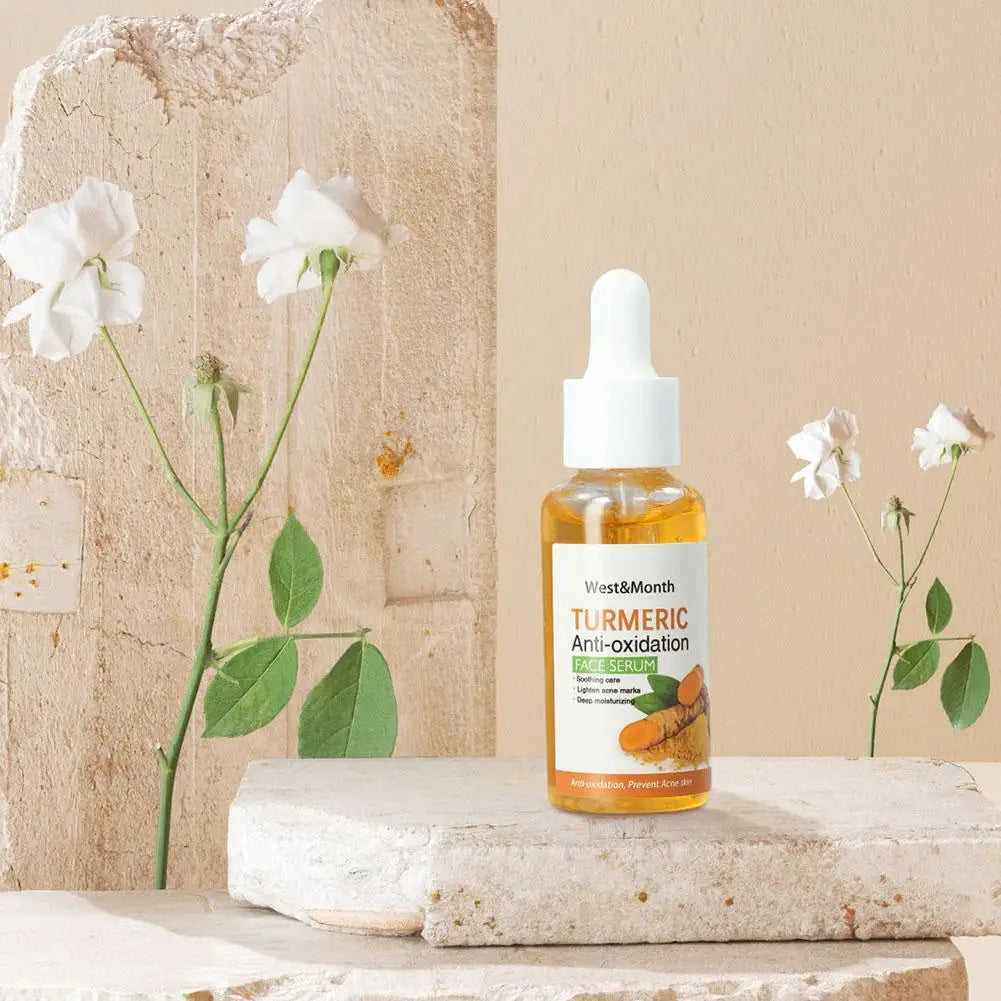 Amber turmeric dark spot corrector face serum bottle displayed on a neutral-toned surface with decorative elements, natural lighting